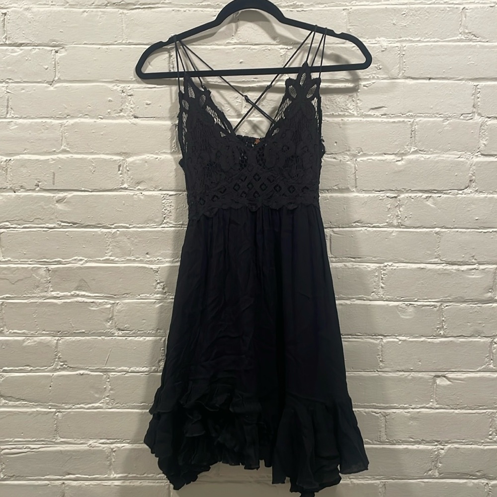 Black Mini Dress with Lace Detail and Ruffle Hem from Free People!